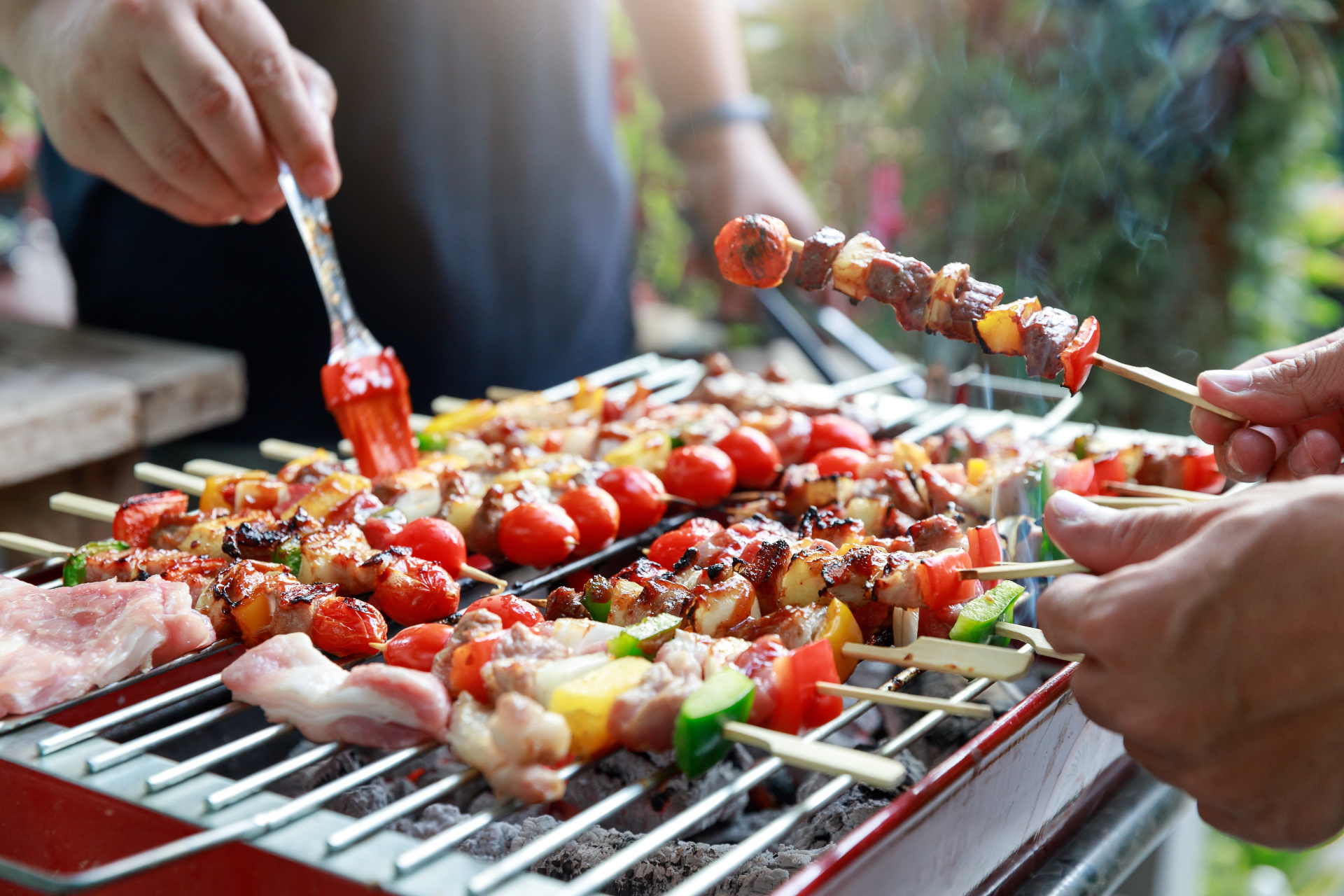 Close up barbecue grill with various kinds of meat.