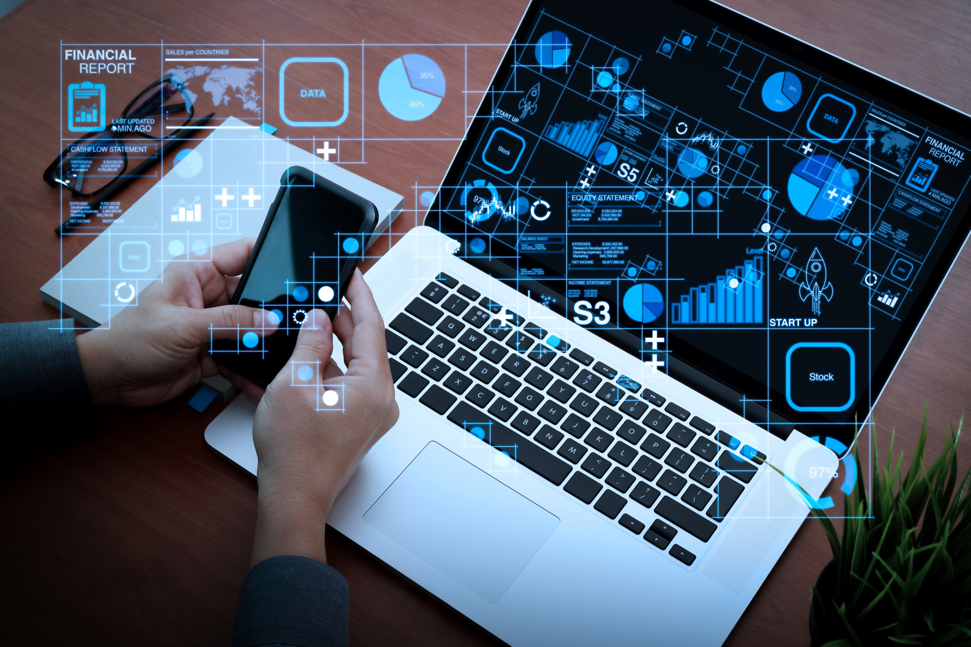 top view of businessman hand using on smart phone and laptop com