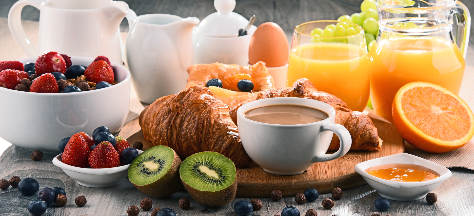 Breakfast served with coffee, juice, croissants and fruits