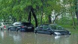 Flooded cars on the street of the city. Street after heavy rain. Water could enter the engine, transmission parts or other places. Disaster Motor Vehicle Insurance Claim Themed. Severe weather concept Flooded cars on the street of the city. Street after heavy rain. Water could enter the engine, transmission parts or other places. Disaster Motor Vehicle Insurance Claim Themed. Severe weather concept