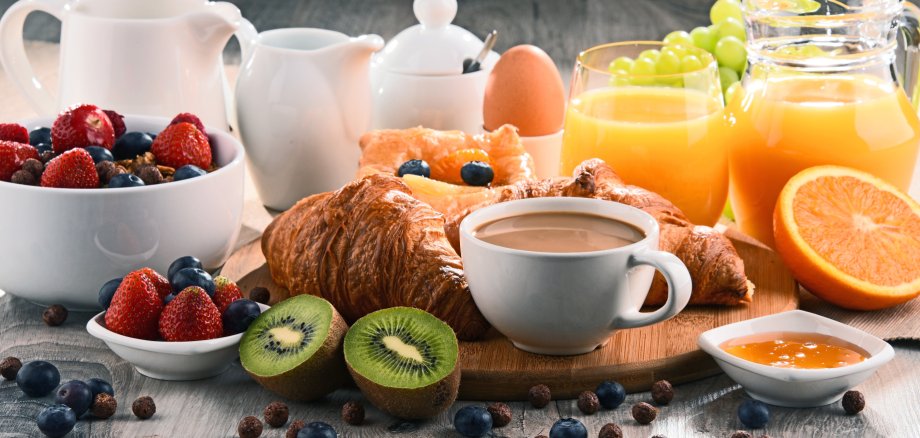Breakfast served with coffee, juice, croissants and fruits
