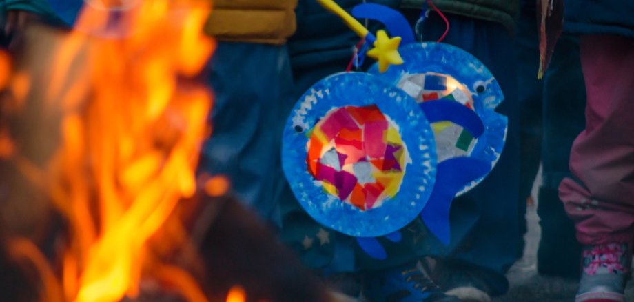 sankt martin day, bonfire and children with lantern defocused