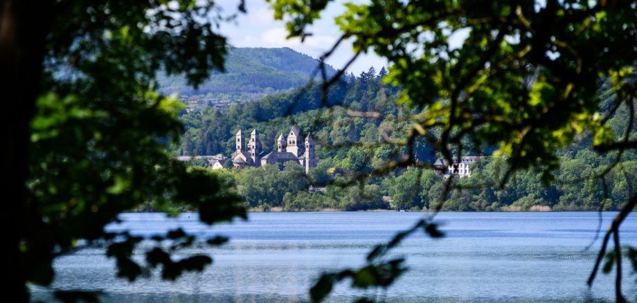The Benedictine monastery in Maria Laach with the Laacher See on a beautiful spring day The Benedictine monastery in Maria Laach with the Laacher See on a beautiful spring day