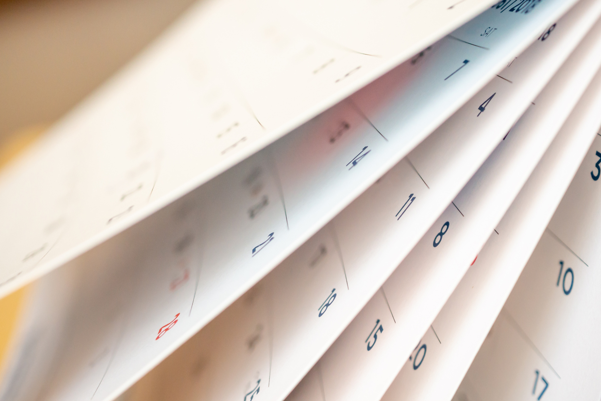 Abstract blur calendar page flipping sheet close up background