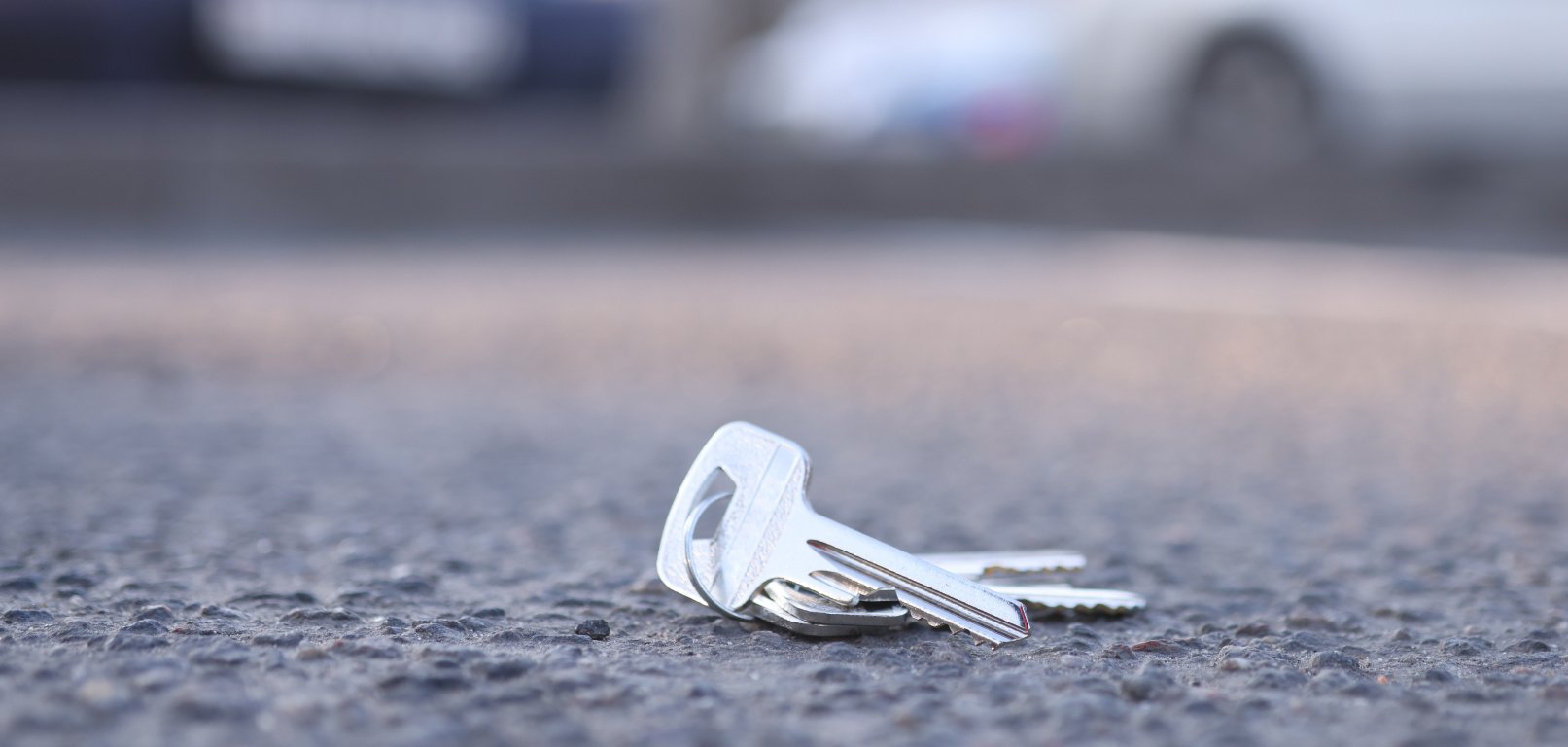 Bunch of keys lies on road in parking lot